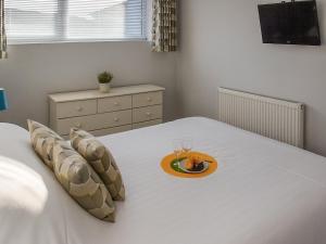 En eller flere senge i et værelse på Sunny Shores + 15 billeder