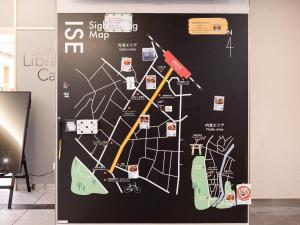 a wall with a map of the moped at Comfort Hotel ERA Ise in Ise +75 photos