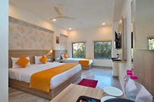 Voodi või voodid majutusasutuse TrimHotel Grandview Jaipur toas