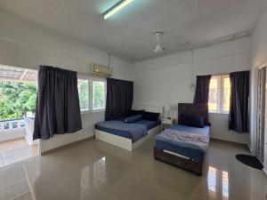 En eller flere senge i et værelse på Jonker Home 2 Walking Distant to Banda Hilir