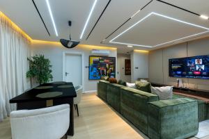 a living room with a couch and a table at FTM Residence in Abuja +9 photos