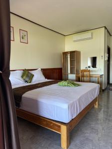 En eller flere senge i et værelse på Dondet Suns down 1 Guesthouses riversides view