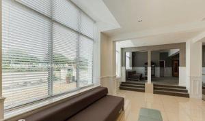 a living room with a large window and a couch at The Park Hotel in Liverpool