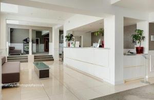 a lobby of a building with a counter in it at The Park Hotel in Liverpool