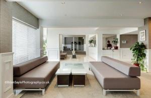 a living room with two couches and a table at The Park Hotel in Liverpool