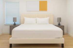 En eller flere senge i et værelse på WorkerFriendly WasherDryer WiFi LongStayDiscount