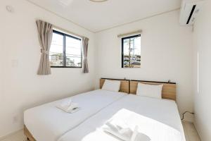 En eller flere senge i et værelse på Ganadan福岡南 + 60 billeder