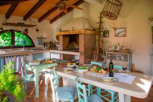 a kitchen with a table and a brick oven at House Moreda by Istrialux in Vodnjan