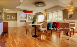 a dining room with a table and chairs at The Park Hotel in Liverpool
