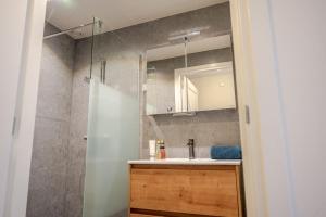 a bathroom with a sink and a mirror at Charming Vacation Home Spier in Spier +30 photos