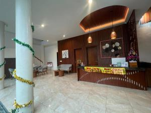 a lobby with a waiting room with a counter at La Tropica Canggu Bali By Kanaya Hospitality in Canggu +29 photos