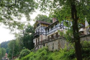 a building on the side of a hill at Hotel Waldhäusel in Bad Schandau