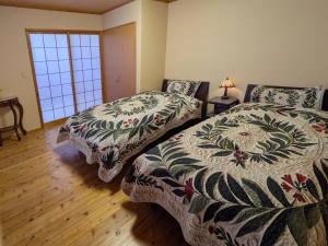 Postel nebo postele na pokoji v ubytování Yufuin Onsen 8A1 Yaeichi