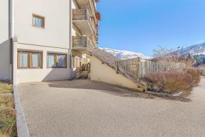 a house with a staircase on the side of it at appartement Superdevoluy in Superdevoluy