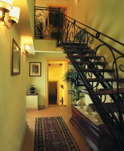 a hallway with a spiral staircase in a house at Palazzo Leti Residenza d'Epoca in Spoleto