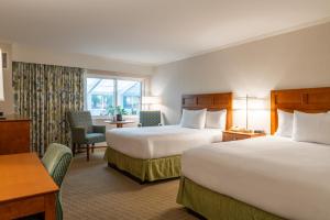 a hotel room with two beds and a desk at Juniper Hill Inn in Ogunquit +52 photos