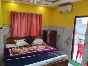 Voodi või voodid majutusasutuse Anjali Inn toas