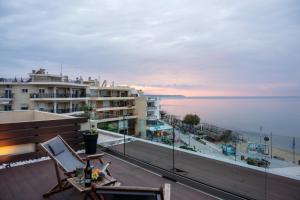 a view of the ocean from the balcony of a building at Vento di Mare in Perea