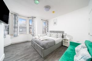 En eller flere senge i et værelse på Gem In Ilford