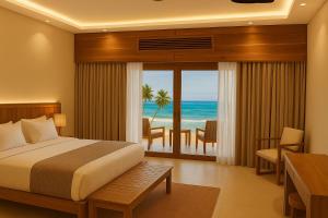 een slaapkamer met een bed en uitzicht op de oceaan bij JAZ Adonia in Uroa