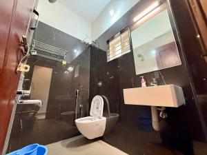 Ένα μπάνιο στο Malpe Serene Stays