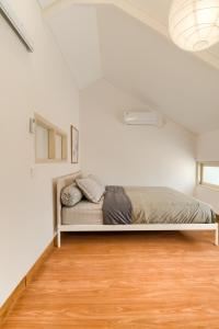 Postel nebo postele na pokoji v ubytování Kata House