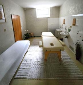 En eller flere senge i et værelse på Horský Hotel Magura