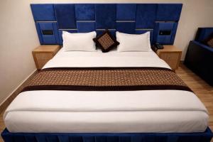 En eller flere senge i et værelse på Riverline Gold Resort + 2 billeder