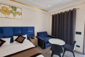 En eller flere senge i et værelse på Riverline Gold Resort