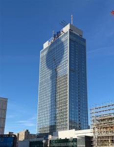 a tall glass building with people on top of it at Park Inn by Radisson Berlin Alexanderplatz in Berlin