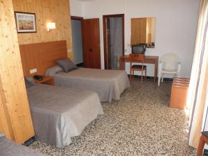 Postel nebo postele na pokoji v ubytování Hotel Jardín