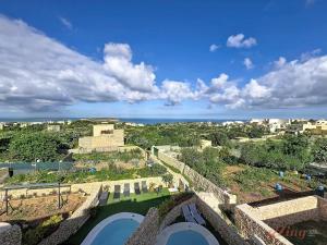 an aerial view of the ruins of a castle at Peaceful Home with Private Pool and Rooftop Jacuzzi in Xagħra
