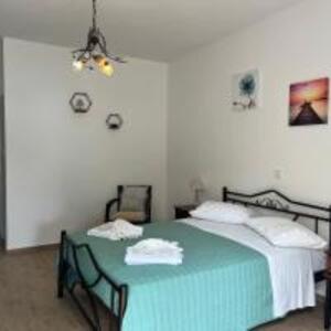 Ένα ή περισσότερα κρεβάτια σε δωμάτιο στο Poseidon Beach Bar & Restaurant Apartments +23 φωτογραφίες