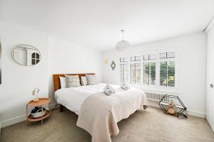 Postel nebo postele na pokoji v ubytování Stylish 3-Bed Home Close to Stansted Airport