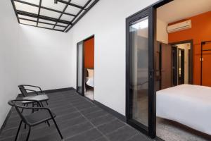 Postel nebo postele na pokoji v ubytování D'Capstone Guesthouse