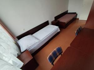a room with two beds and a couch at Dom Studenta nr 5 in Siedlce