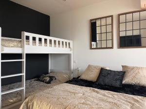 En eller flere senge i et værelse på Vue mer Incroyable !