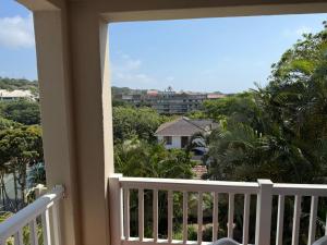 a balcony with a view of a city at 222 Laguna La Crete in Margate