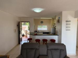 a living room with a couch and a kitchen at 222 Laguna La Crete in Margate