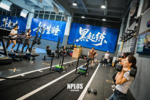 a group of people exercising in a gym at Grey Parrot Resort Hotel in Chengdu