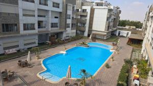 an overhead view of a swimming pool in a building at Maison 7 New Cairo in Cairo