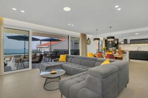 a living room with a couch and a table at Villa Bacula in Veliko Brdo