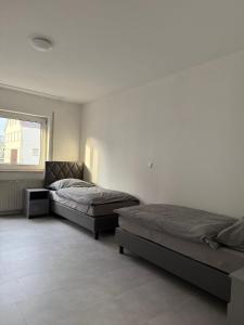 Postel nebo postele na pokoji v ubytování Monteurwohnung Lampertheim + 6 fotografií
