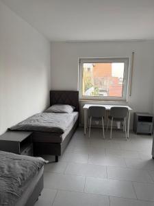 Postel nebo postele na pokoji v ubytování Monteurwohnung Lampertheim