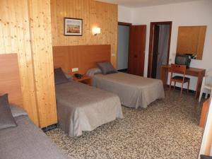 Postel nebo postele na pokoji v ubytování Hotel Jardín