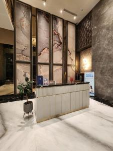 En eller flere senge i et værelse på City View Studio Apartement South Surabaya