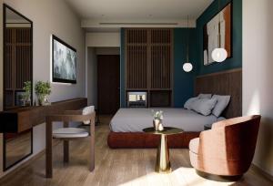 a hotel room with a bed and a table and chairs at The Stanley in Athens