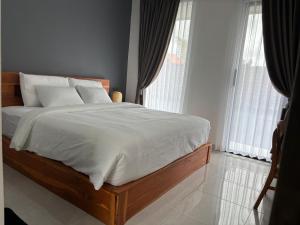 Postel nebo postele na pokoji v ubytování Laziela Guest House