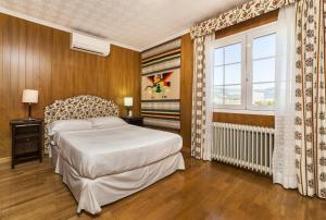 En eller flere senge i et værelse på Villa Palmanova by Priority Villas