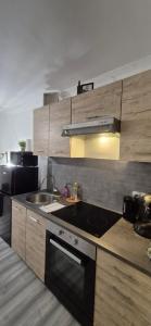 Køkken eller tekøkken på T2 Cosy - Coeur Amiens